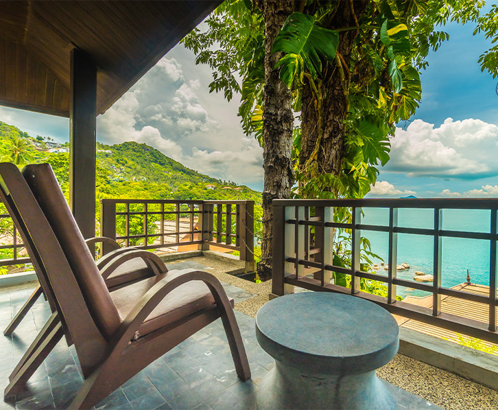 balcony of private villa overlooking a tropical beach